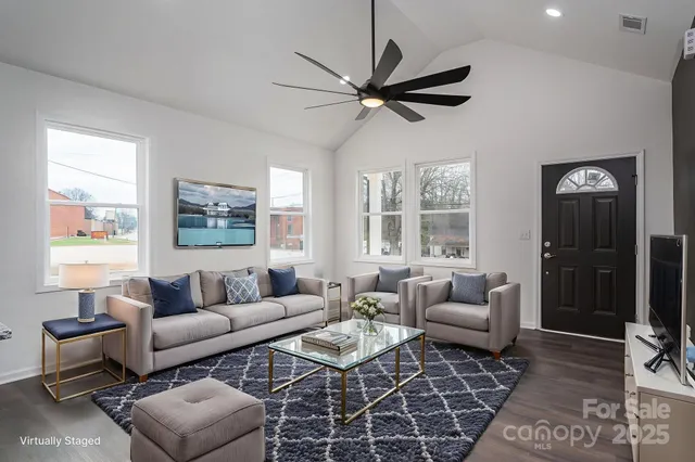 a living room with furniture and a large window
