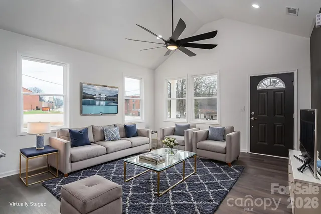 a living room with furniture and a large window