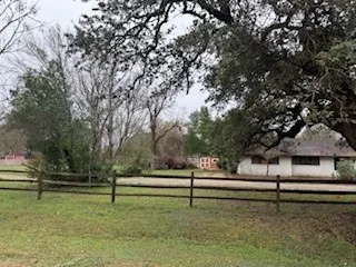 a view of backyard with green space