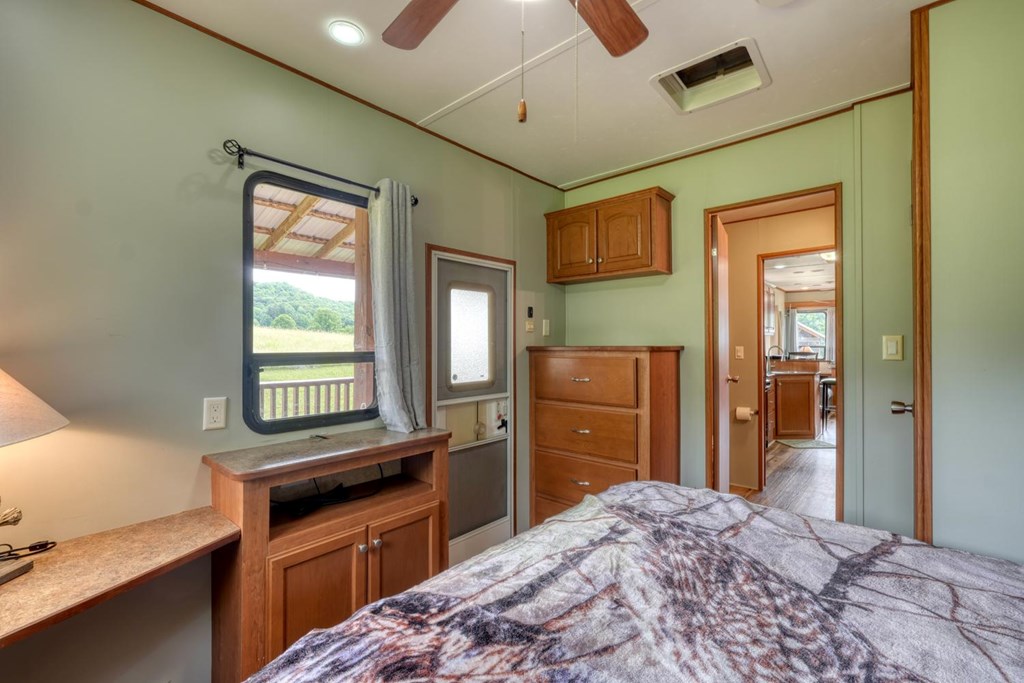 568 Parks Road Hiawassee, GA 30546 - Photo 21 of 38 a kitchen with a refrigerator and a stove