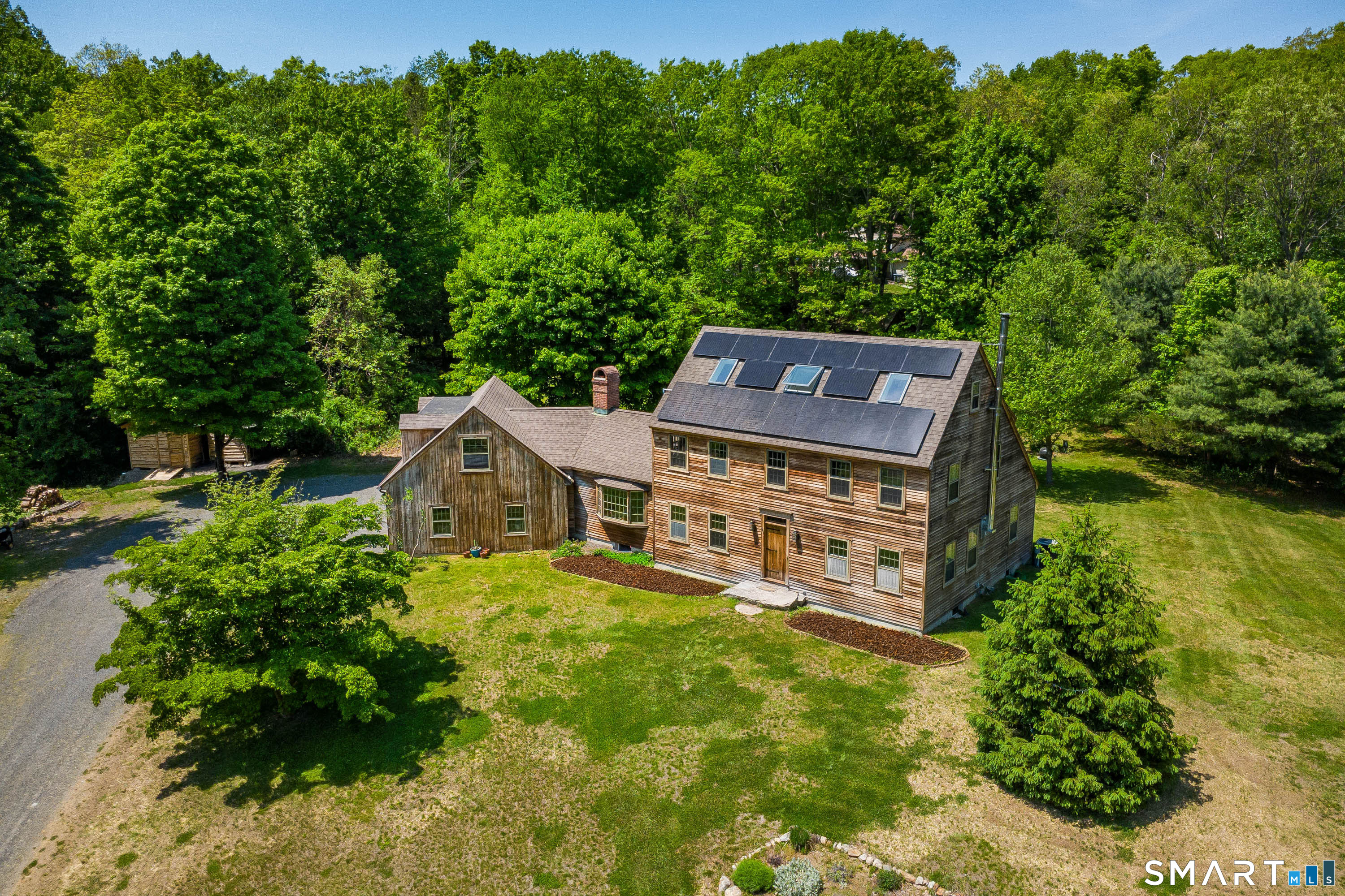 174 Huntingtown Road Newtown, CT 06470 - Photo 1 of 40 an aerial view of a house with a yard