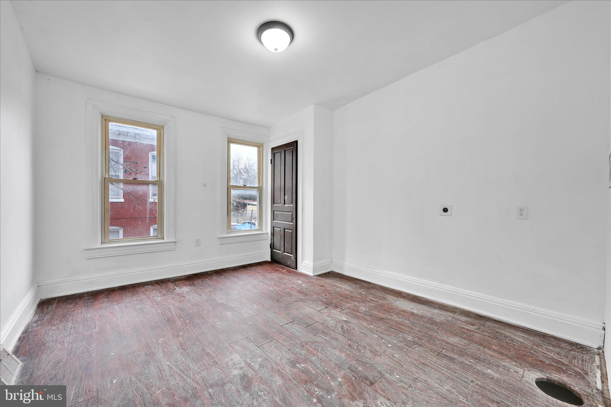 132 North West Street York, PA 17401 - Photo 18 of 23 an empty room with wooden floor and windows
