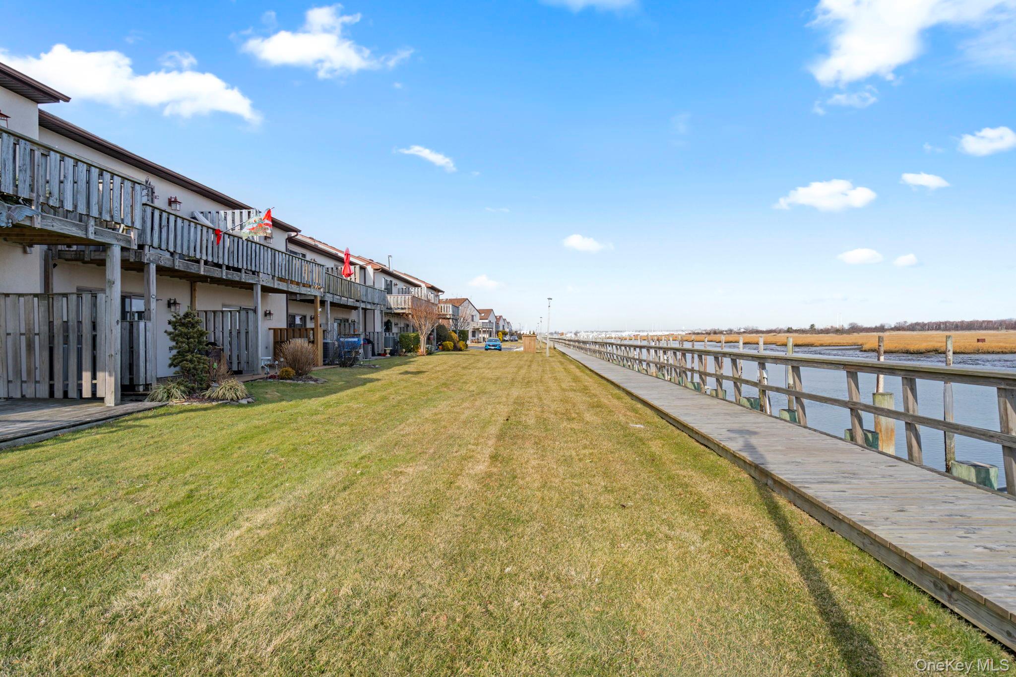 1 Anchorage Way, Unit 101 Freeport, NY 11520 - Photo 17 of 31 a view of swimming pool with seating area