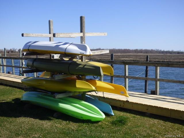 1 Anchorage Way, Unit 101 Freeport, NY 11520 - Photo 22 of 31 a view of a swimming pool with a yard