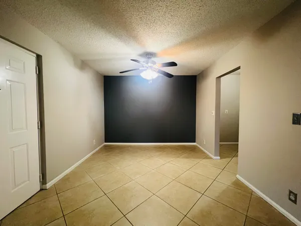 a view of an empty room with glass door