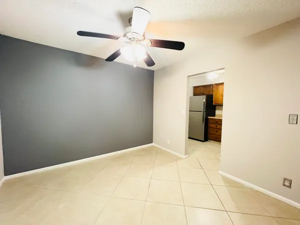 a view of an empty room with a bathroom