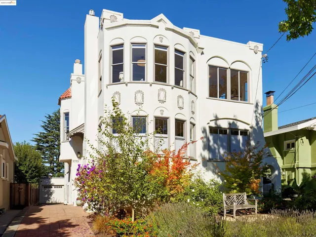a large building with a lot of flower plants