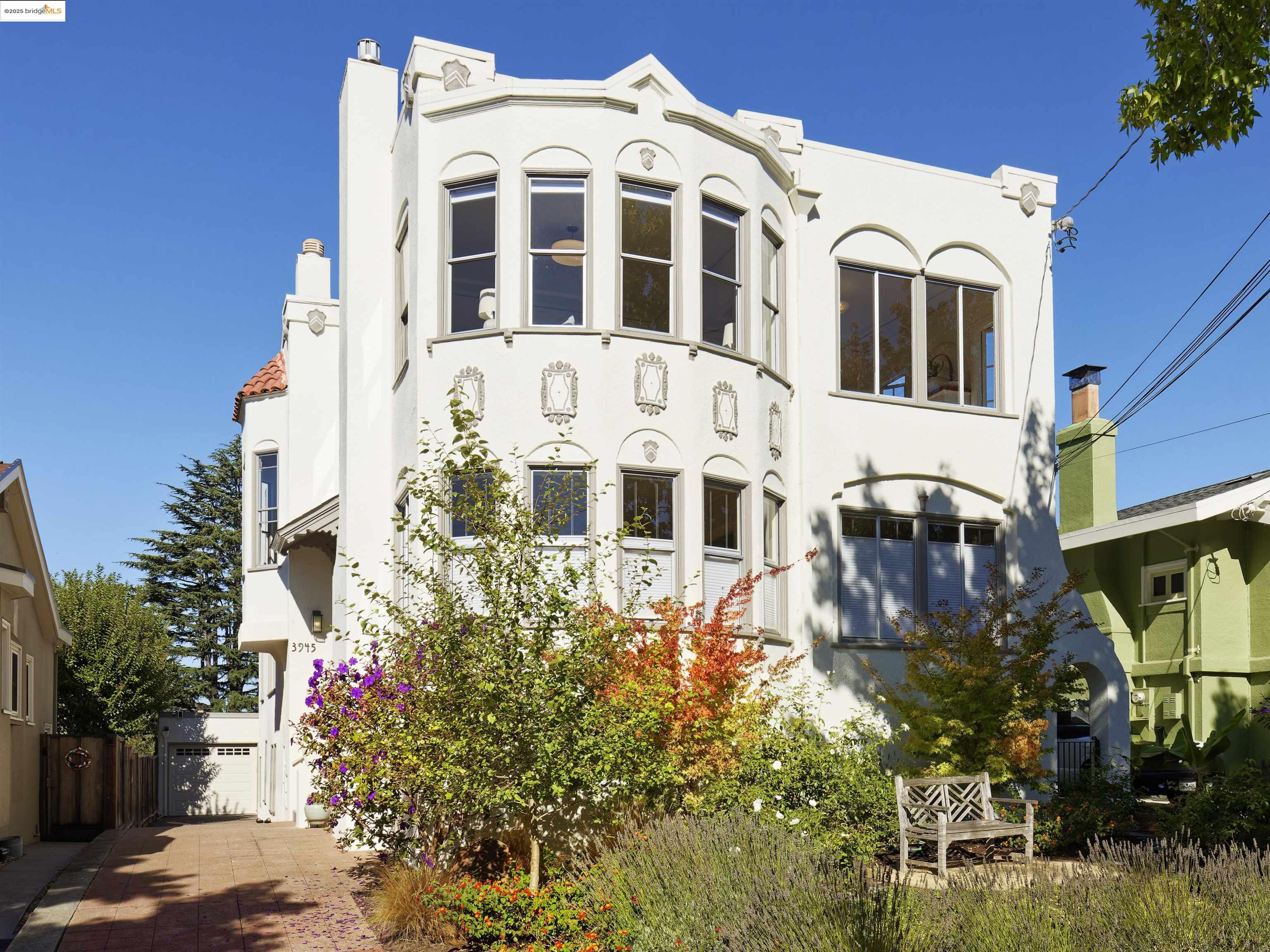 3945 Randolph Avenue, Unit 2 Oakland, CA 94602 - Photo 1 of 43 a large building with a lot of flower plants