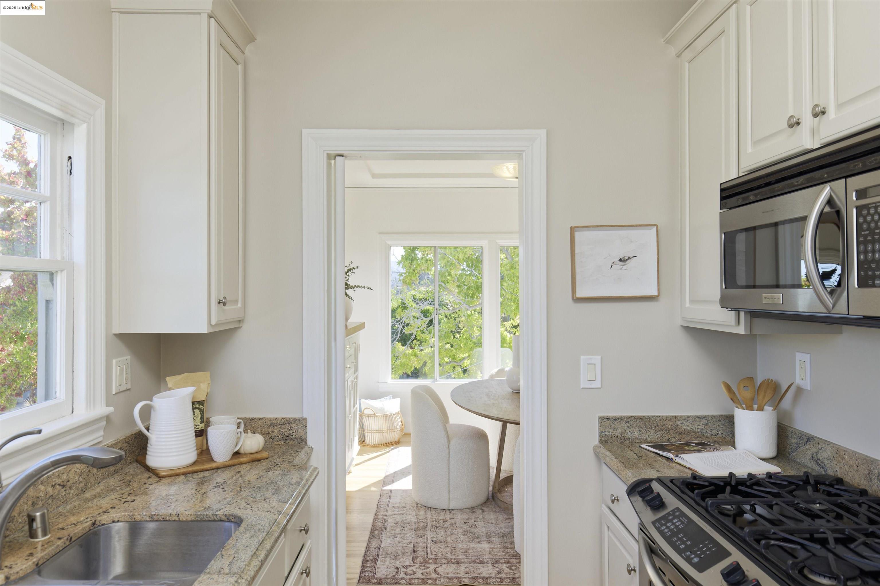 3945 Randolph Avenue, Unit 2 Oakland, CA 94602 - Photo 15 of 43 a kitchen with a stove and a white cabinet