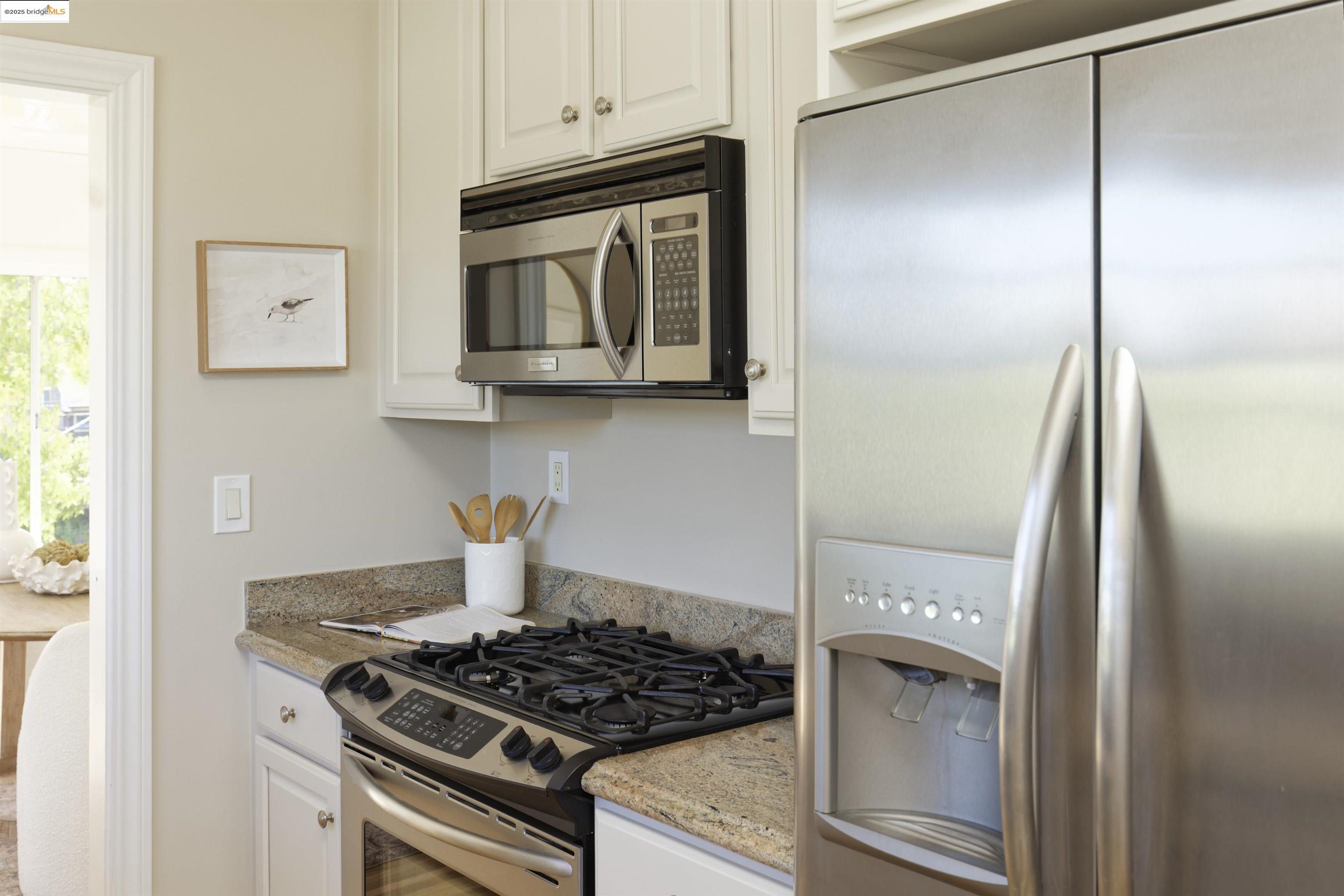 3945 Randolph Avenue, Unit 2 Oakland, CA 94602 - Photo 16 of 43 a kitchen with a stove and a microwave