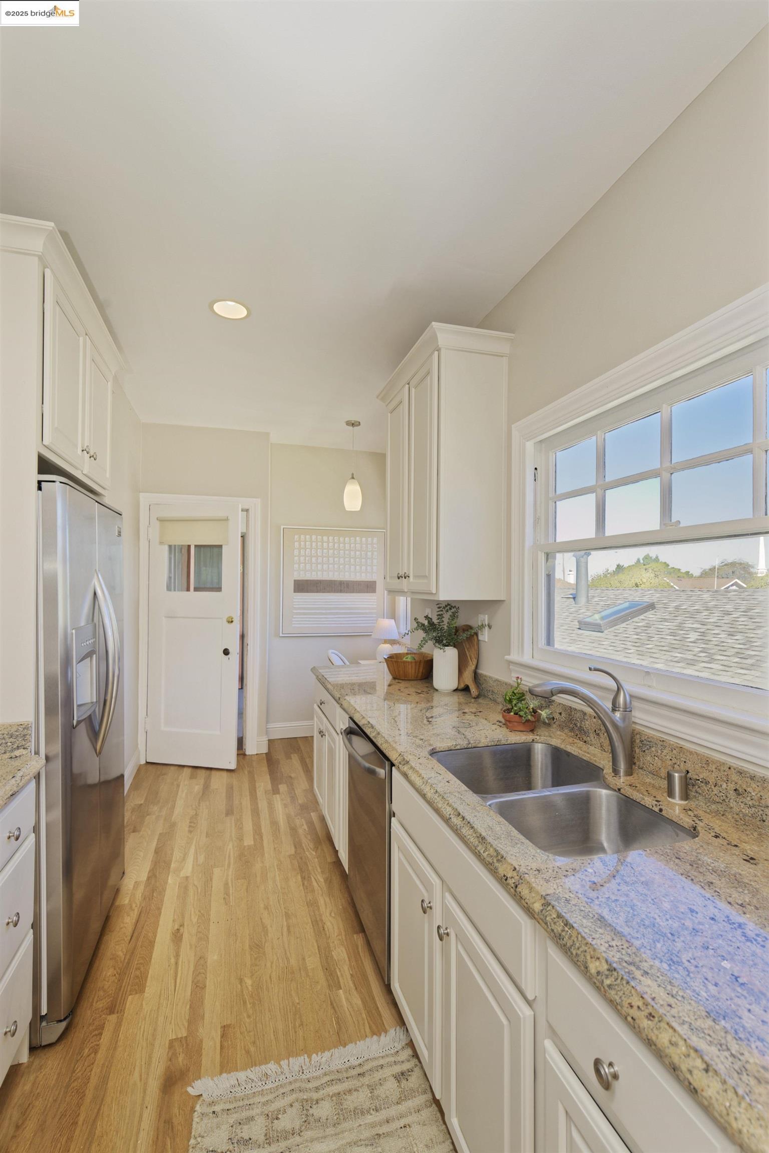 3945 Randolph Avenue, Unit 2 Oakland, CA 94602 - Photo 18 of 43 a kitchen with a sink stove and cabinets