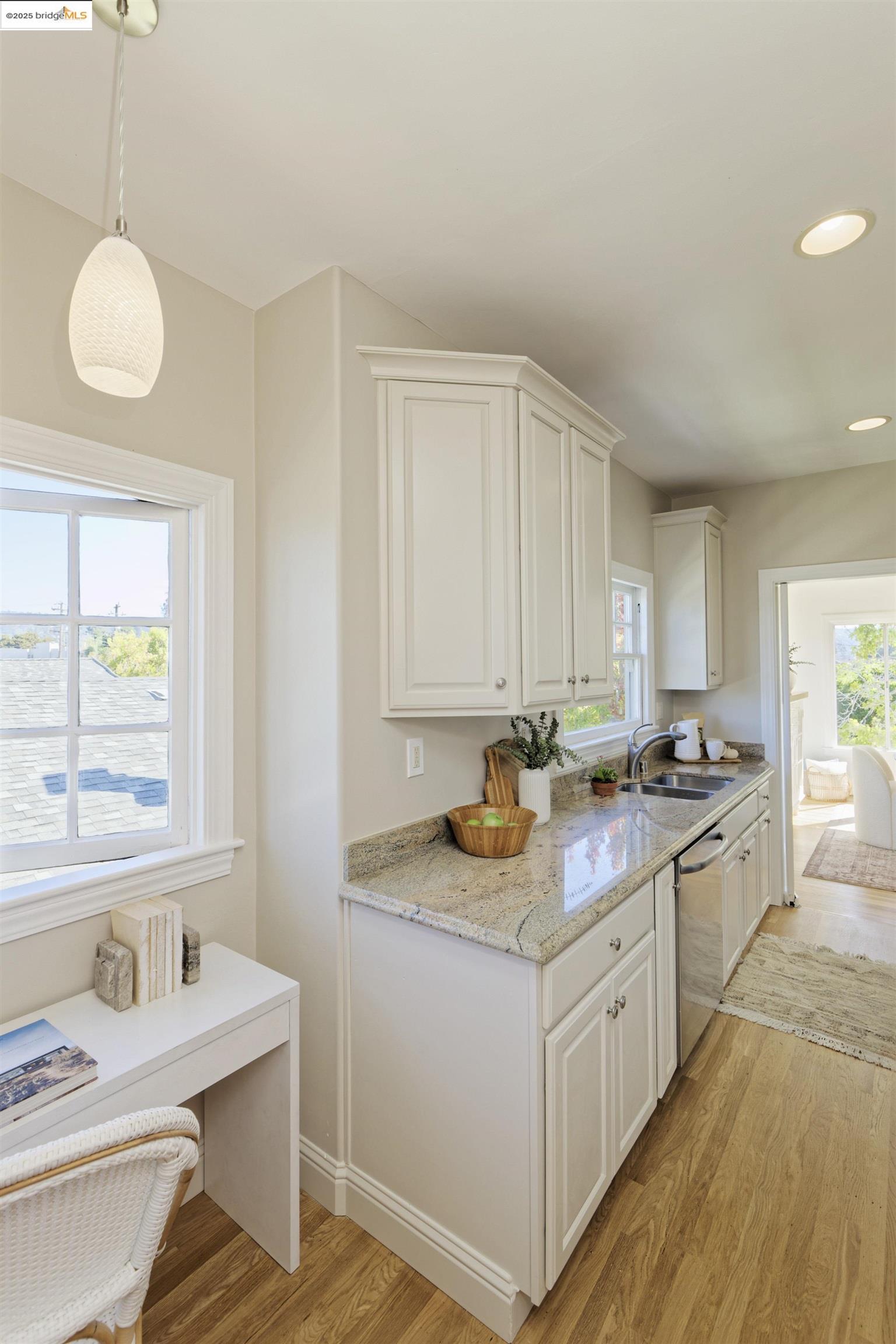 3945 Randolph Avenue, Unit 2 Oakland, CA 94602 - Photo 19 of 43 a kitchen with stainless steel appliances granite countertop a sink stove and cabinets