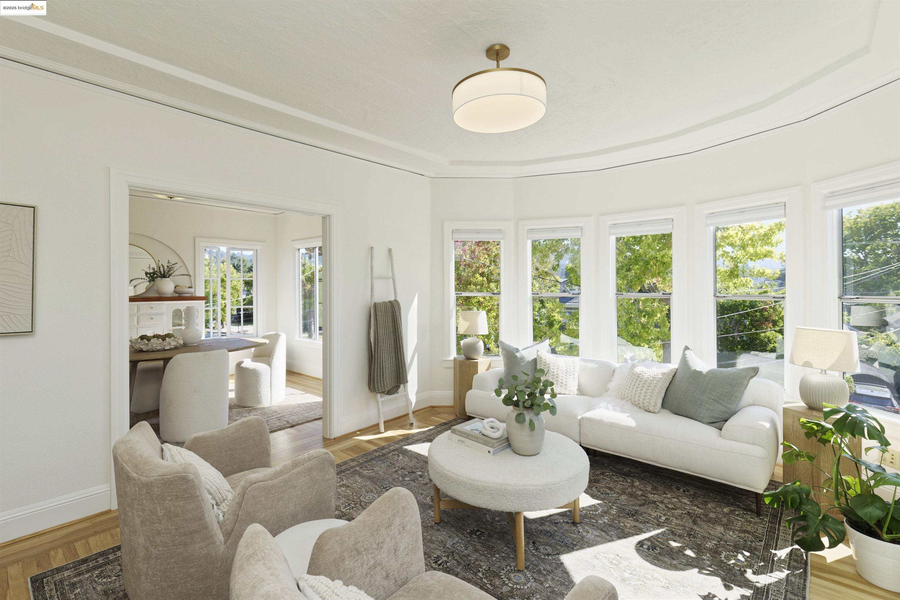 3945 Randolph Avenue, Unit 2 Oakland, CA 94602 - Photo 2 of 43 a living room with furniture and a large window