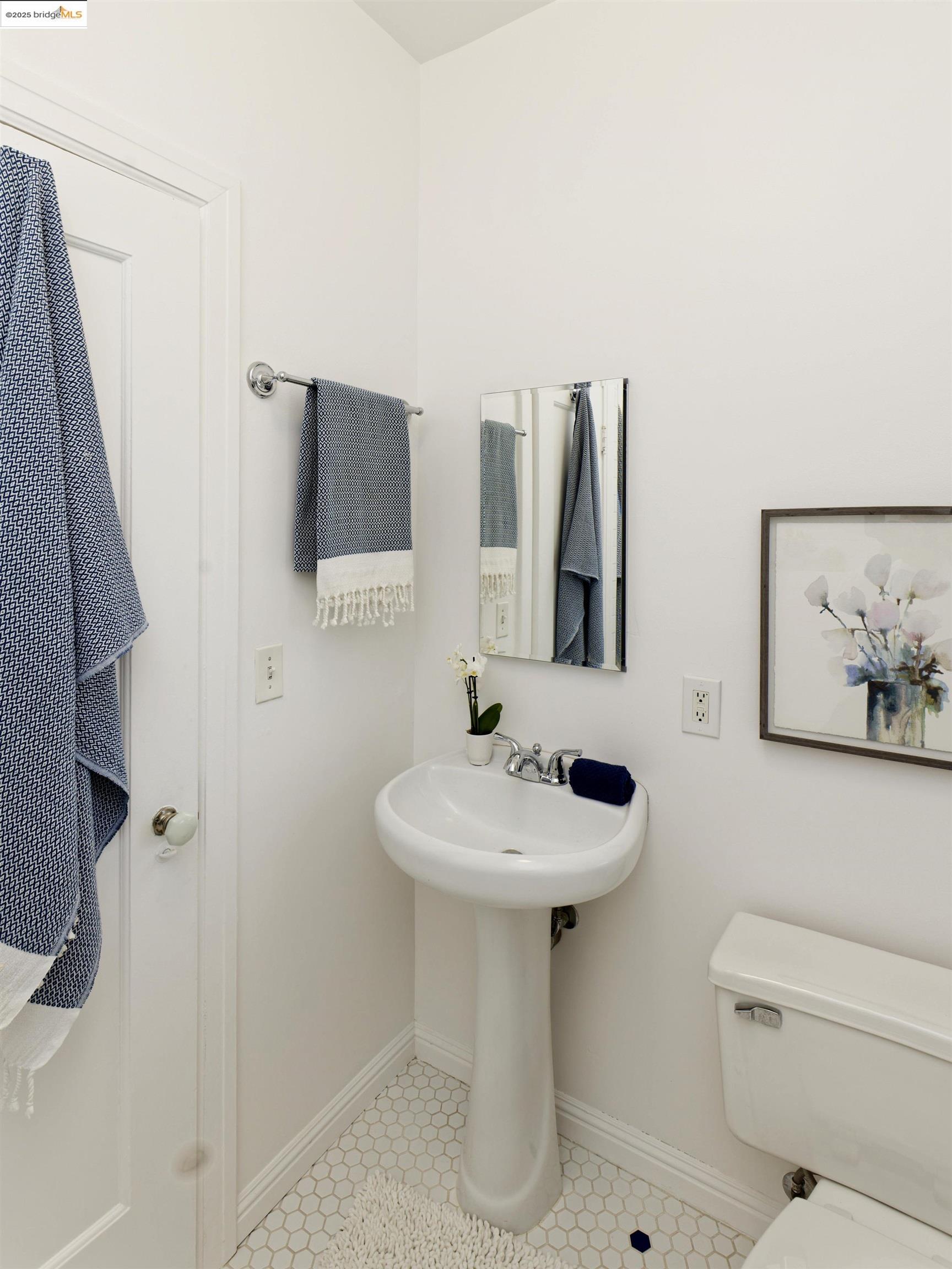 3945 Randolph Avenue, Unit 2 Oakland, CA 94602 - Photo 23 of 43 a bathroom with a sink toilet and mirror