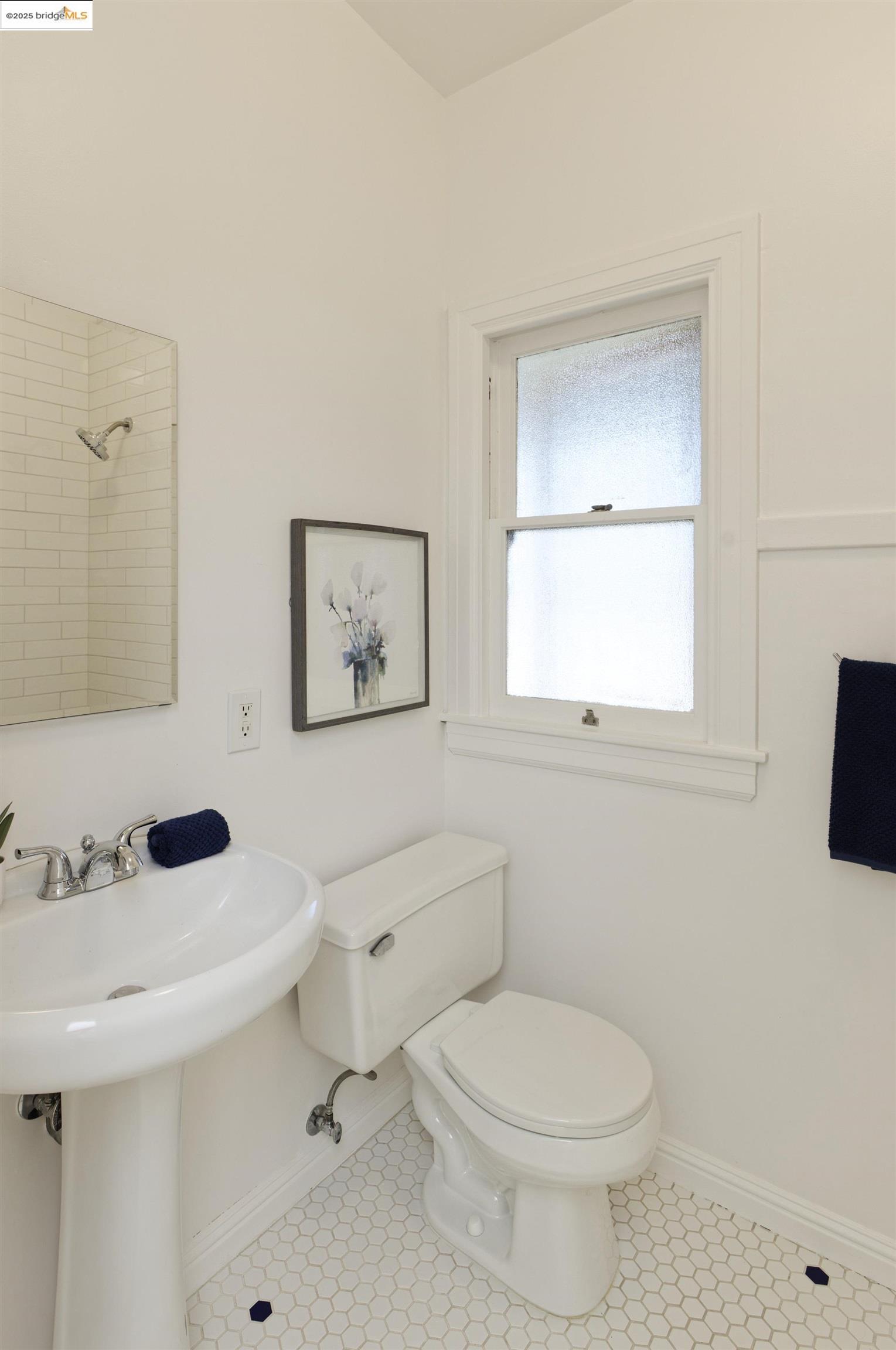 3945 Randolph Avenue, Unit 2 Oakland, CA 94602 - Photo 24 of 43 a bathroom with a sink a toilet and mirror