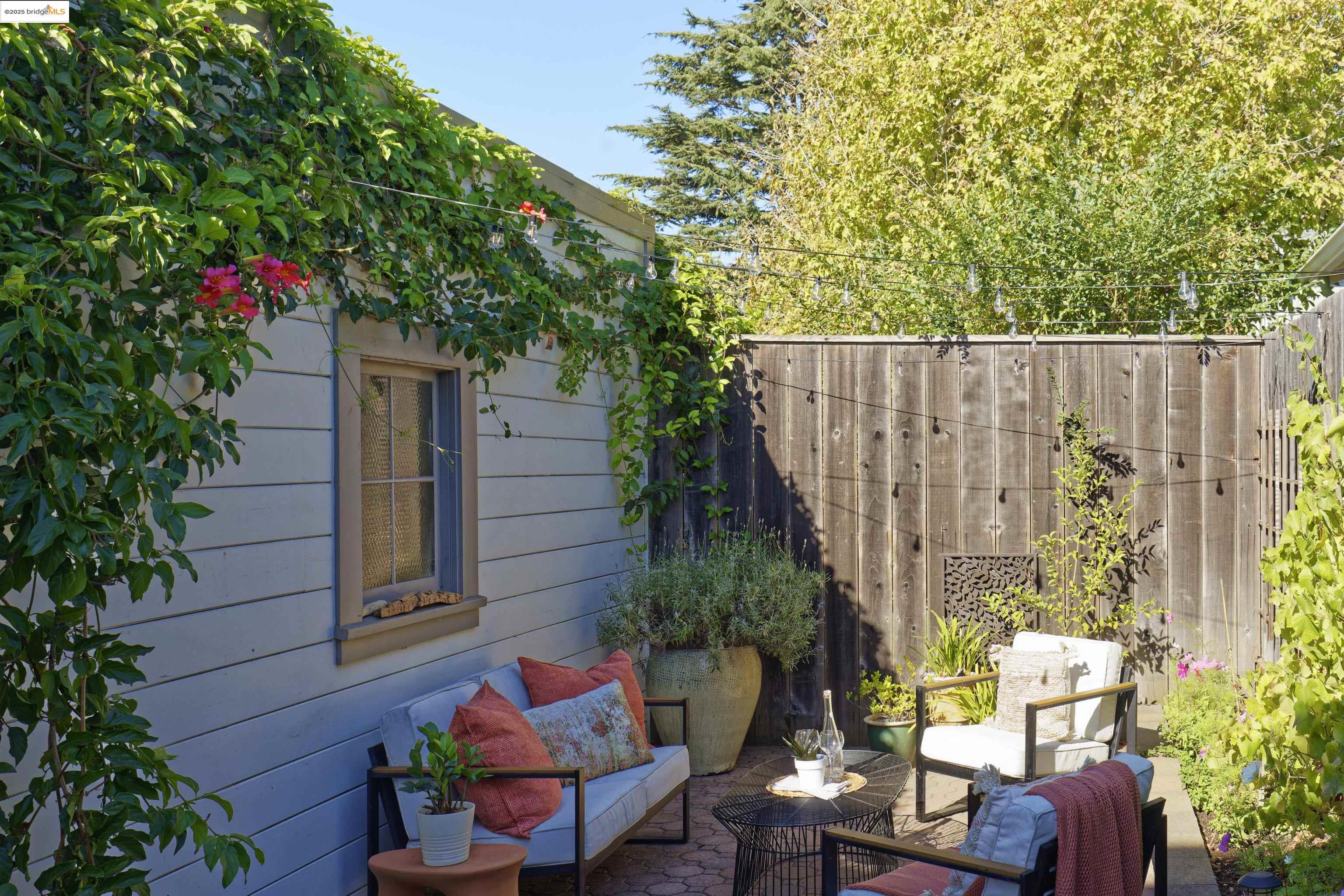 3945 Randolph Avenue, Unit 2 Oakland, CA 94602 - Photo 32 of 43 a backyard of a house with seating space and trees