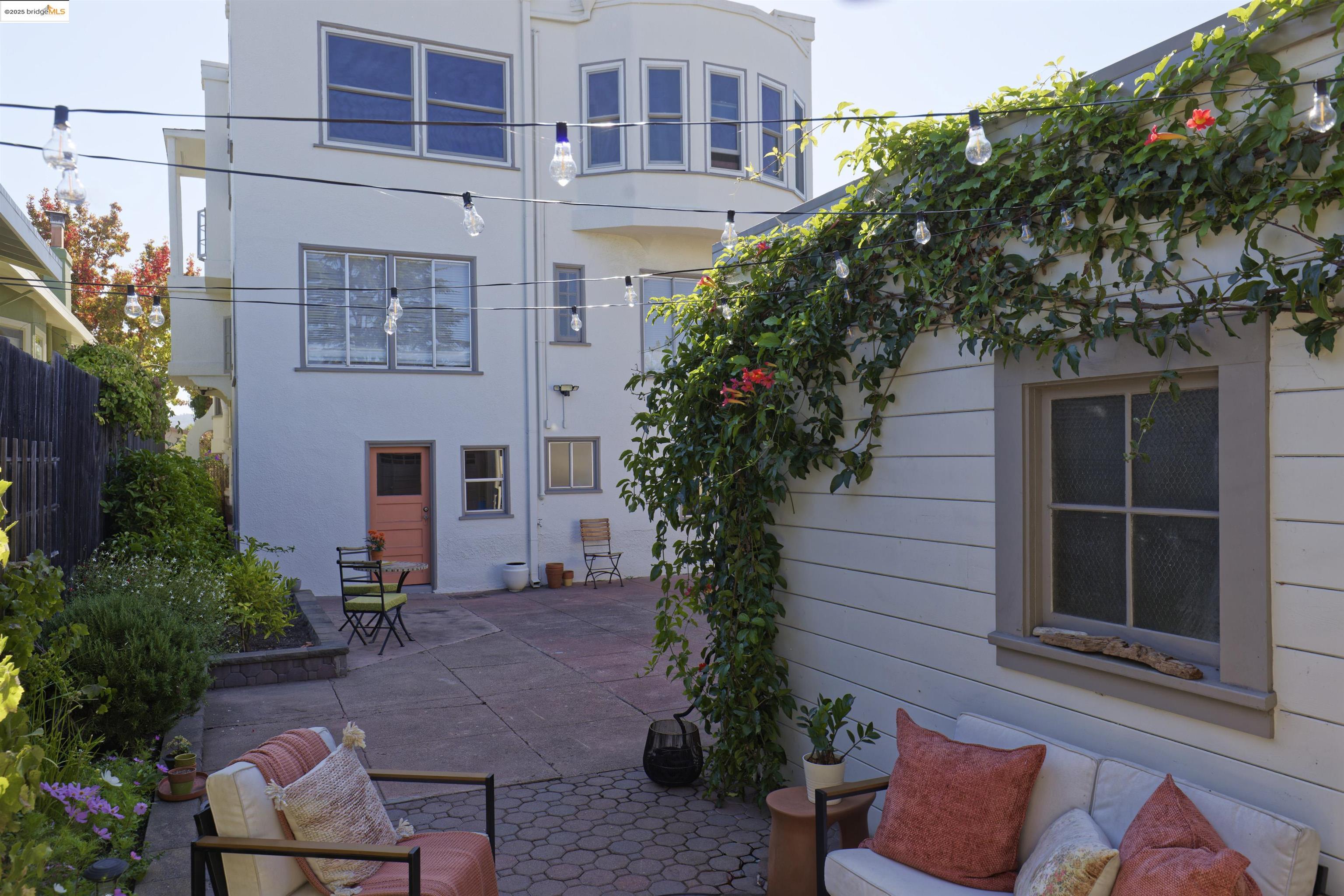 3945 Randolph Avenue, Unit 2 Oakland, CA 94602 - Photo 33 of 43 a view of a building with potted plants and a bench