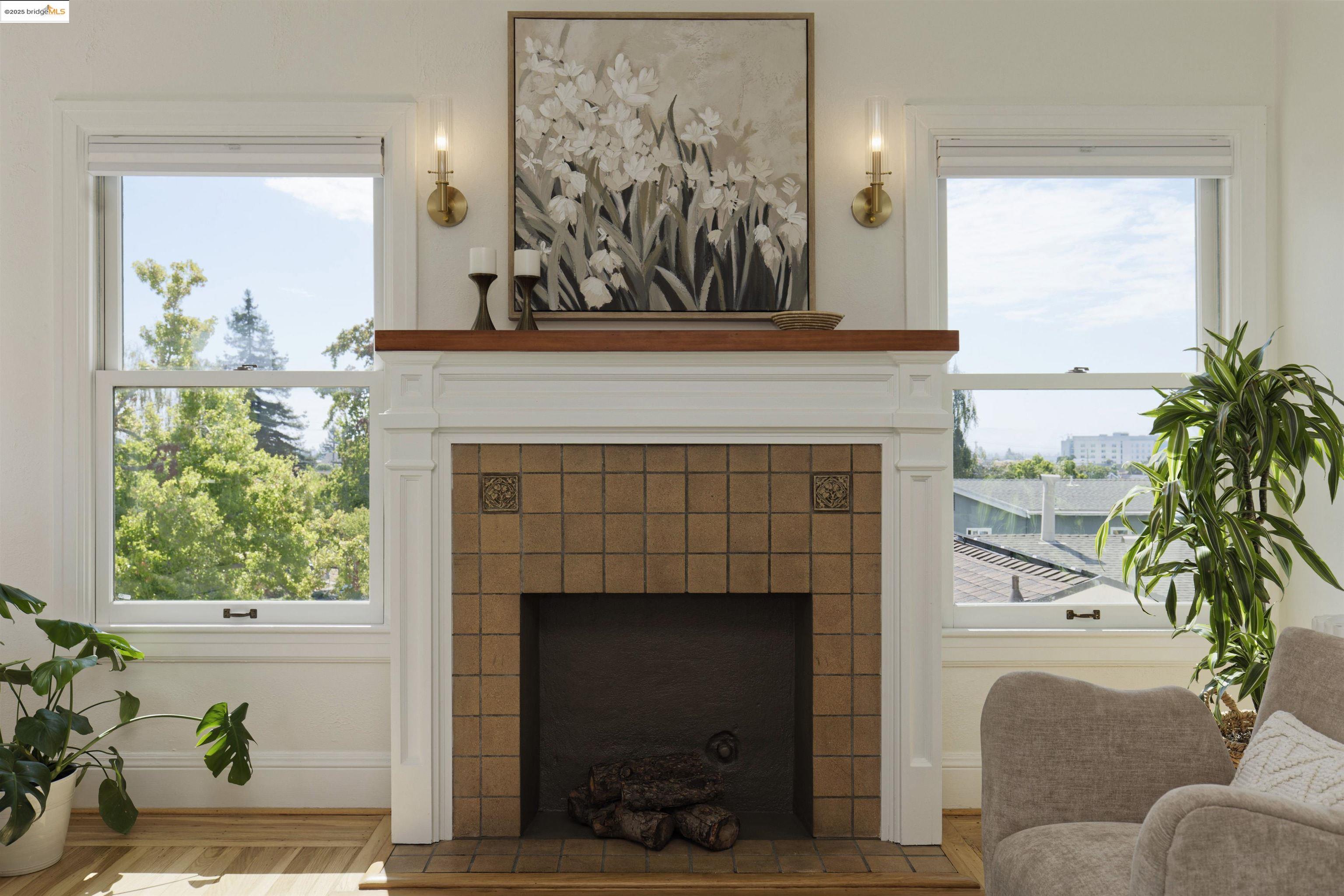 3945 Randolph Avenue, Unit 2 Oakland, CA 94602 - Photo 5 of 43 a living room with a fireplace and a large window