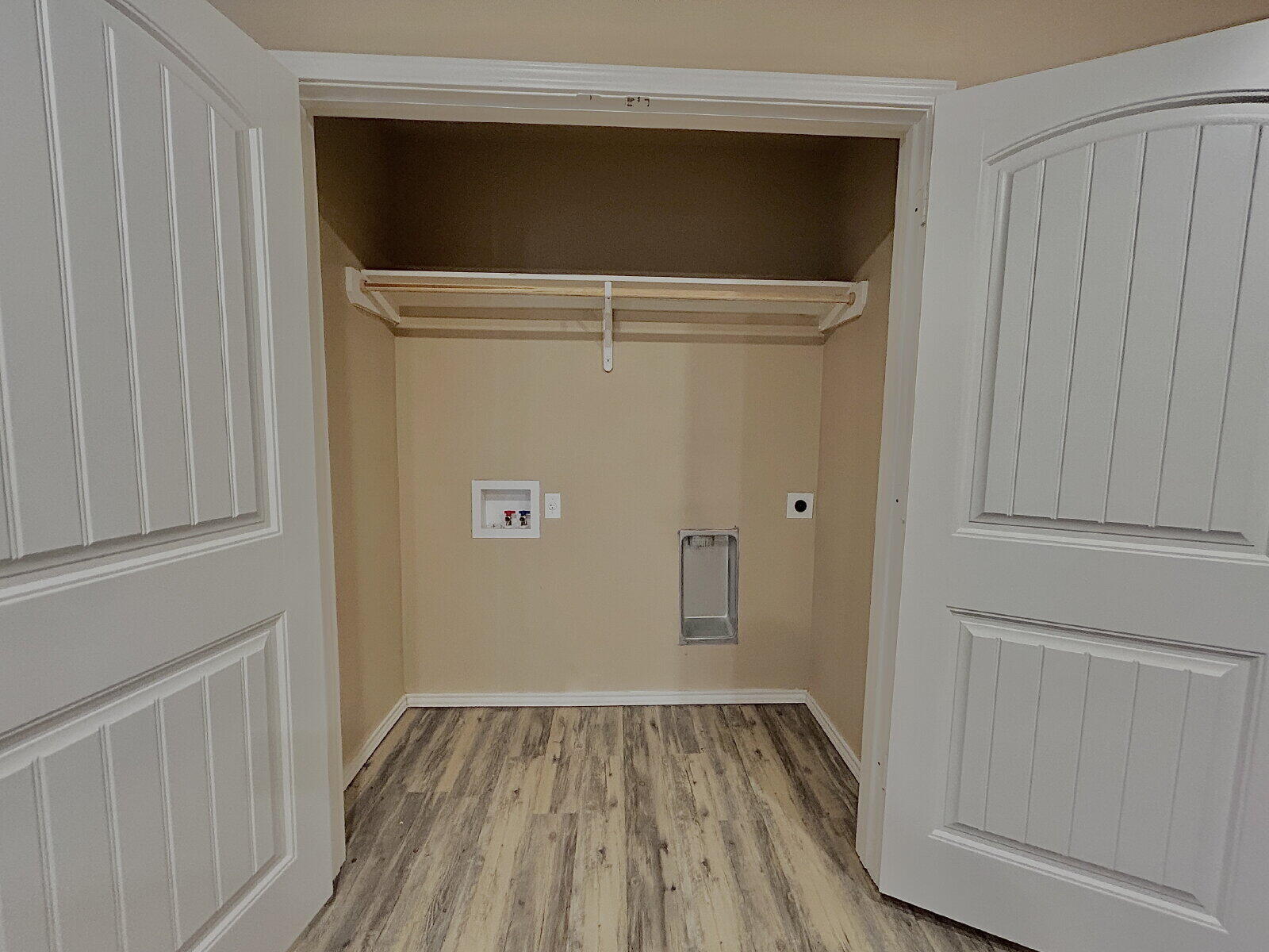 7413 5th Street, Unit 1 Lubbock, TX 79416 - Photo 6 of 11 a view of an empty room with wooden floor
