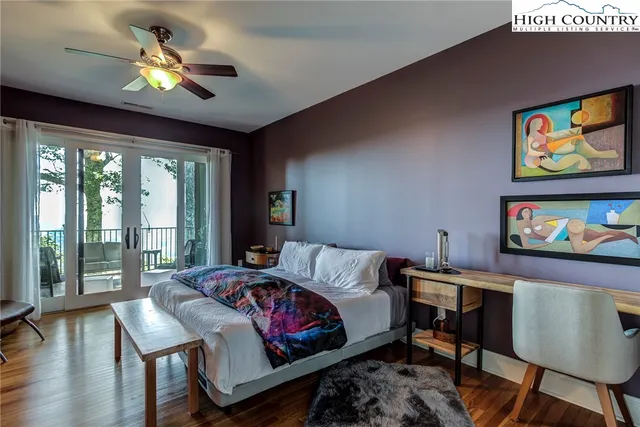 a bedroom with furniture and a chandelier