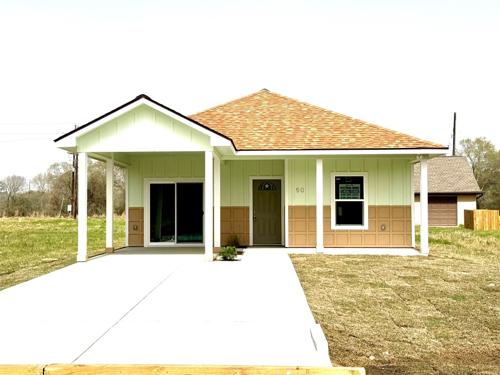 a house view with a garden space