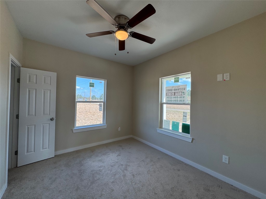 50 Westlake West Trinity, TX 75862 - Photo 12 of 23 an empty room with windows and fan