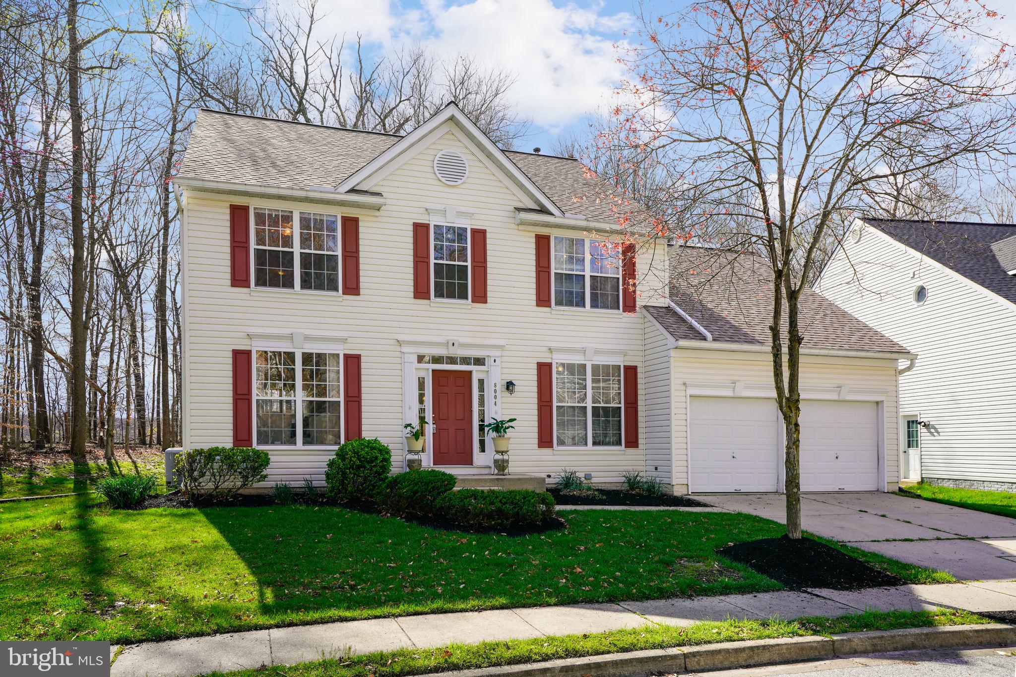 8004 Big Pool Road Laurel, MD 20724 - Photo 1 of 39 a view of a white house with a yard and large tree