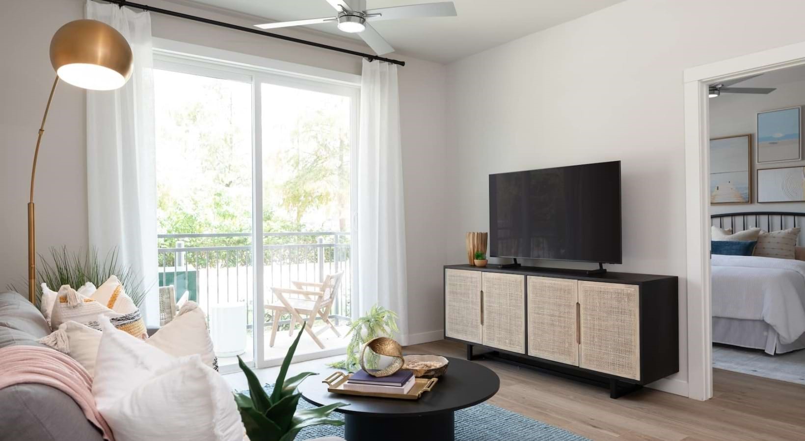 19101 Town Ridge Lane, Unit 4106 Webster, TX 77598 - Photo 2 of 30 a living room with furniture and a flat screen tv