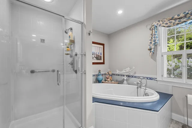 a bedroom with furniture and a wooden floor