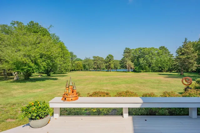 a view of a lake with a yard