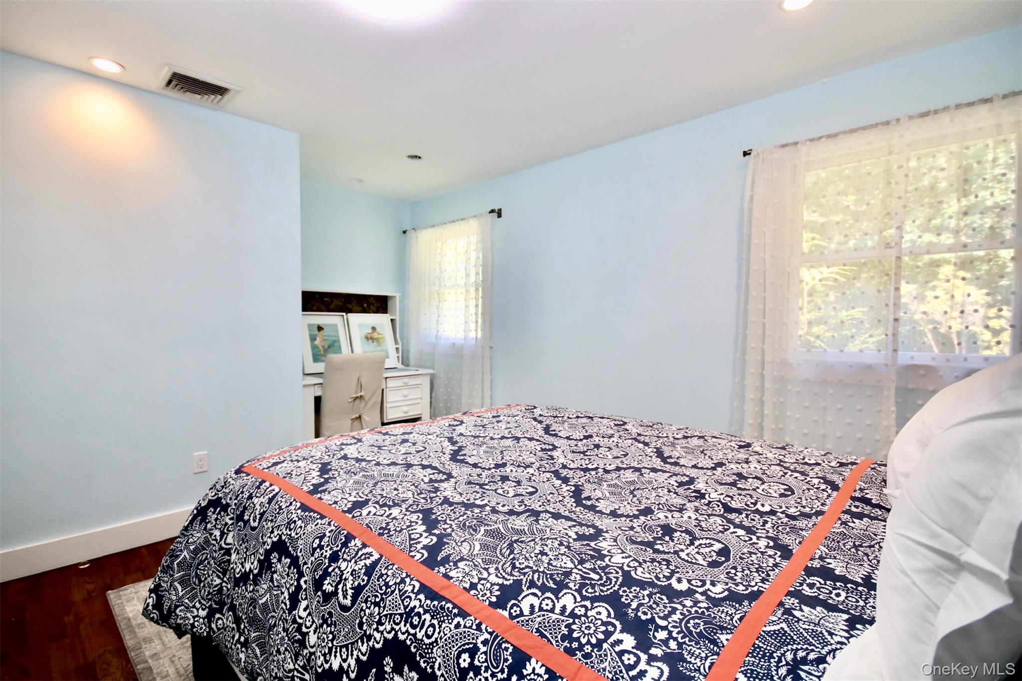 28 Old Trail Road Water Mill, NY 11976 - Photo 17 of 25 a bedroom with a bed and a window