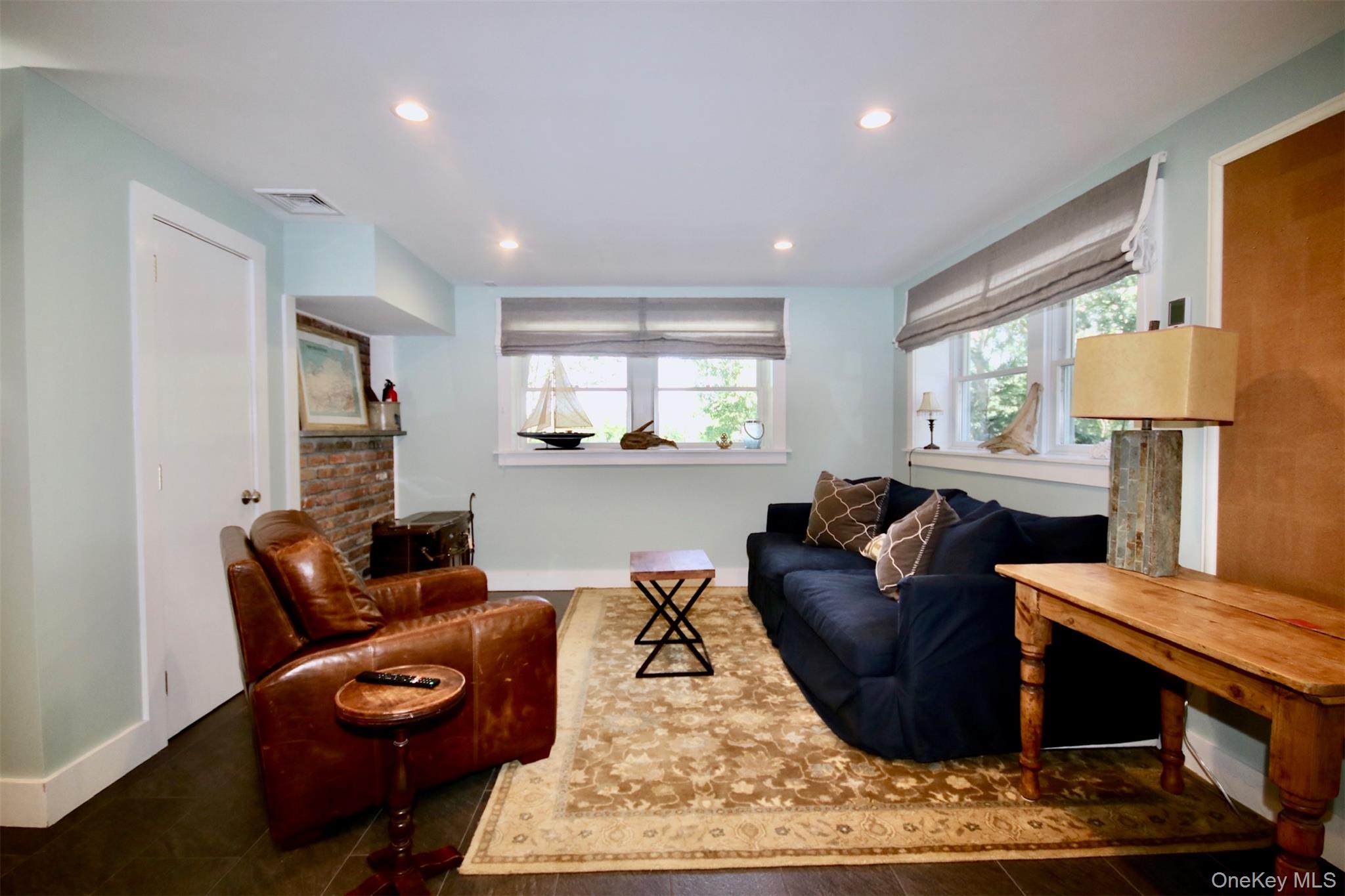 28 Old Trail Road Water Mill, NY 11976 - Photo 23 of 25 a living room with furniture rug and window