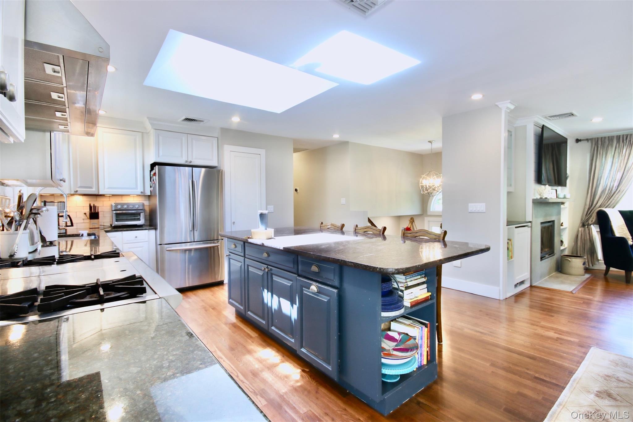 28 Old Trail Road Water Mill, NY 11976 - Photo 4 of 25 a kitchen with stainless steel appliances granite countertop a sink stove and refrigerator