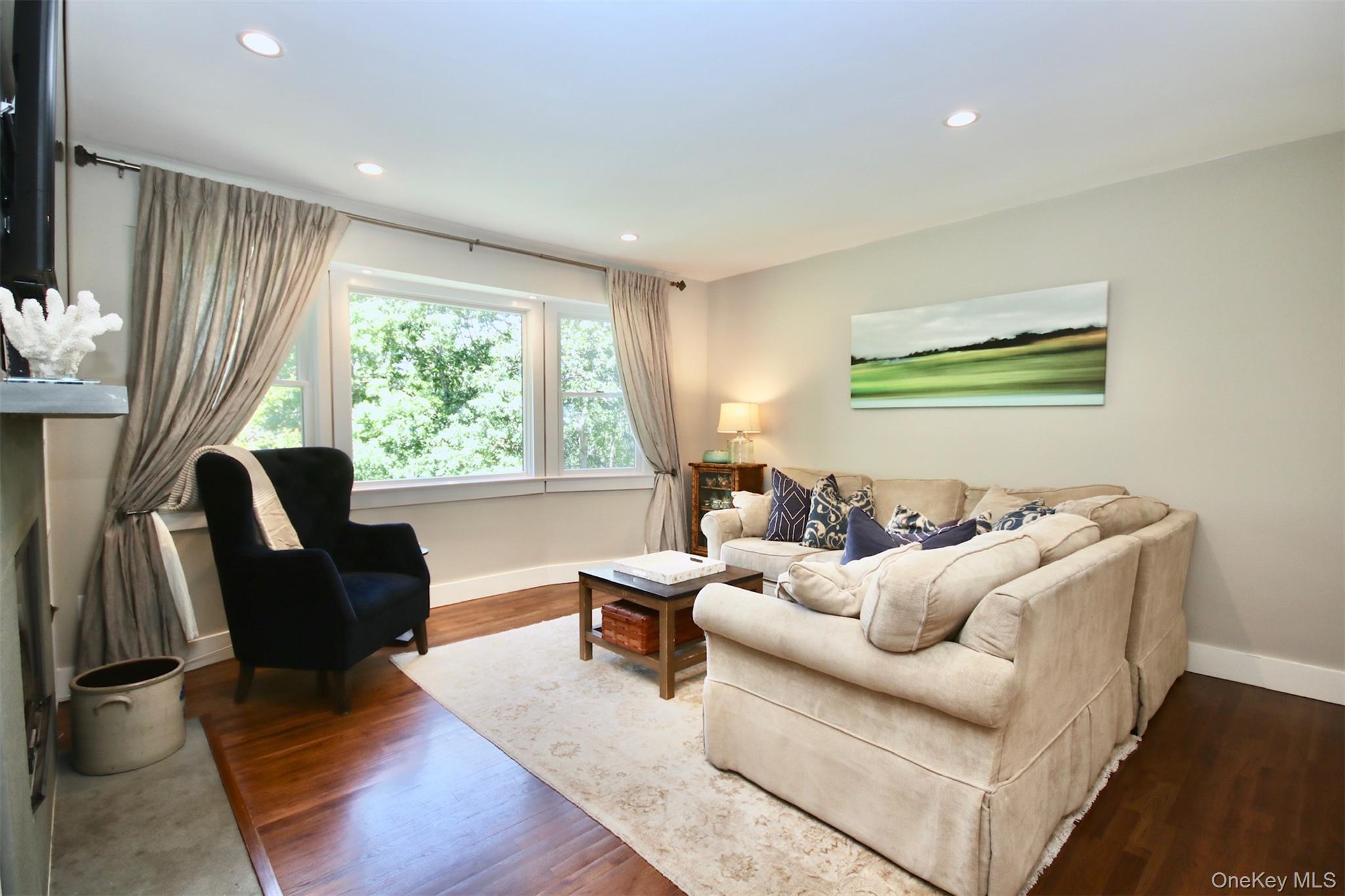28 Old Trail Road Water Mill, NY 11976 - Photo 9 of 25 a living room with furniture and a large window