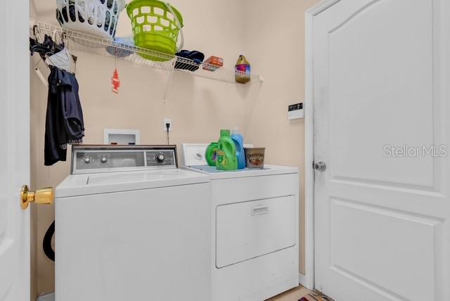 5120 Shale Ridge Trail Orlando, FL 32818 - Photo 15 of 15 a utility room with dryer and washer