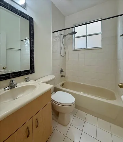 a bathroom with a sink a toilet and a bathtub