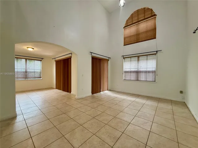 a view of an empty room and window