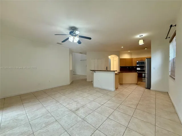a view of a kitchen with a sink and a microwave