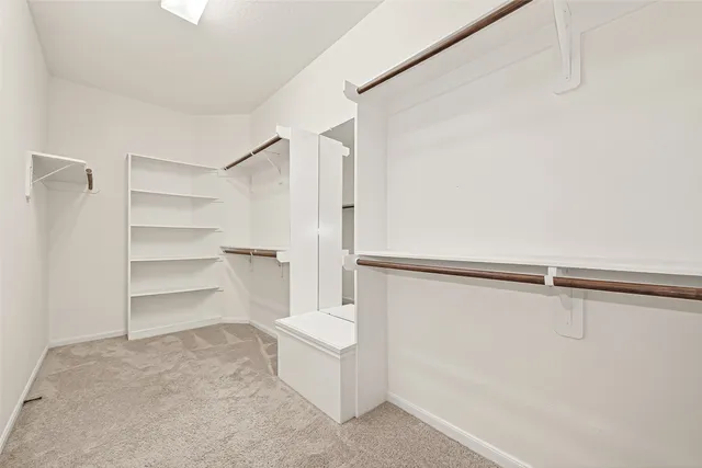 a view of an empty walk in closet