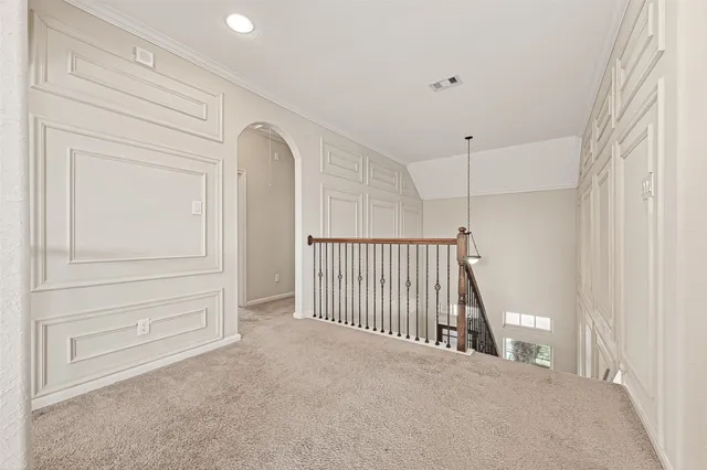 a view of a hallway to rooms