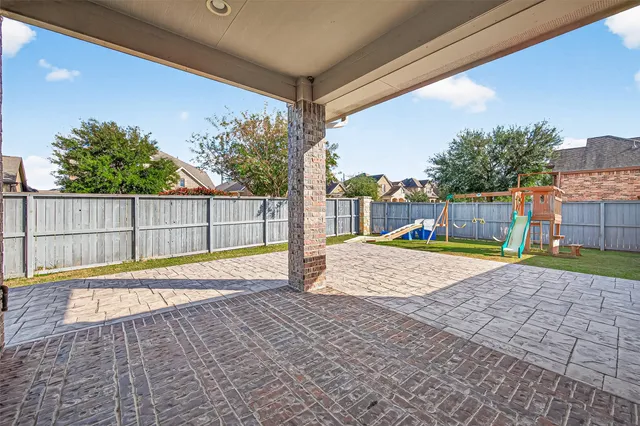a view of swimming pool with a yard