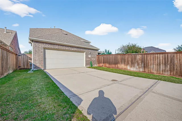 a view of a house with a yard and a slide