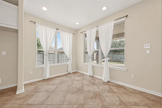 a large white room with a large window