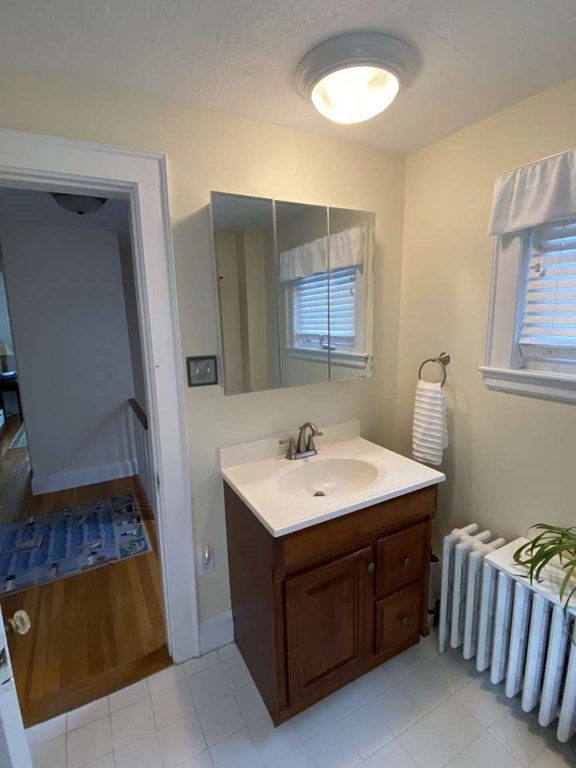 52 Governor Long Road Hingham, MA 02043 - Photo 11 of 19 a bathroom with a sink and a mirror