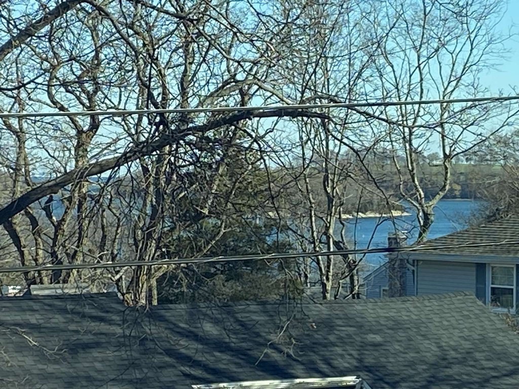 52 Governor Long Road Hingham, MA 02043 - Photo 18 of 19 a backyard of a house with lots of green space