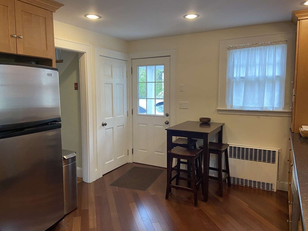 52 Governor Long Road Hingham, MA 02043 - Photo 3 of 19 a view of a dining room with furniture and wooden floor