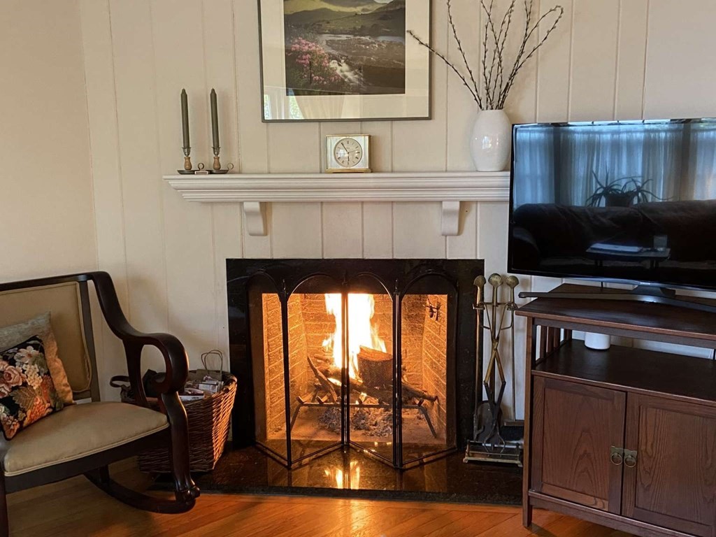 52 Governor Long Road Hingham, MA 02043 - Photo 8 of 19 a living room with furniture a flat screen tv and a fireplace