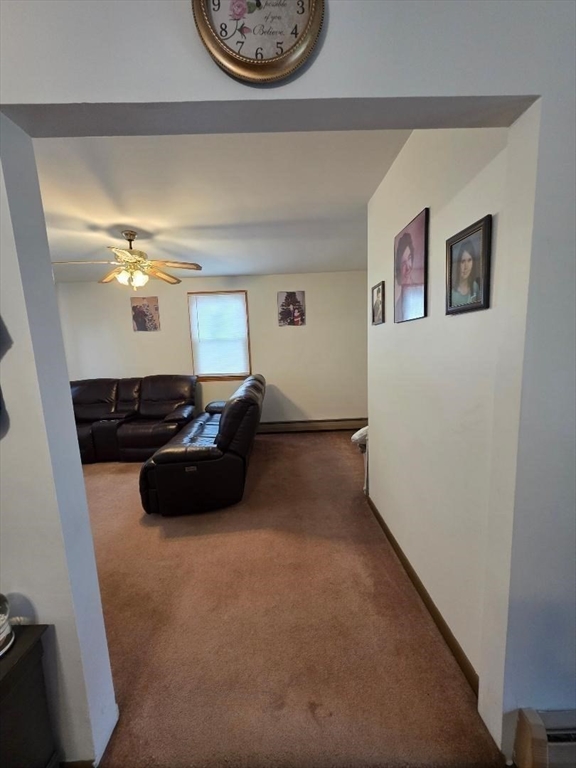 478 Tucker Street Fall River, MA 02721 - Photo 26 of 38 a living room with furniture and a wall painting