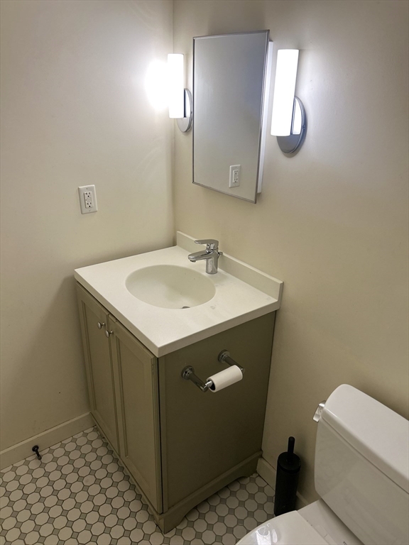 10 Linwood Street, Unit 1 Boston, MA 02119 - Photo 6 of 11 a bathroom with a sink toilet and vanity