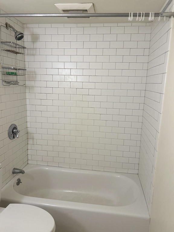 10 Linwood Street, Unit 1 Boston, MA 02119 - Photo 7 of 11 a bathroom with a bathtub and shower